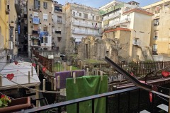 We boarded a train and in about an hour and a half, we were in Naples, which was a very different world. Something going on everywhere you looked. There was even a ruin outside of our apartment window.