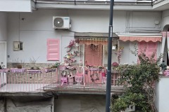 An adorable pink apartment outside of the hustle and bustle of central Naples.