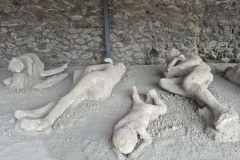 Plaster casts of preserved eruption victims. Some still have the skeletal remains inside.
